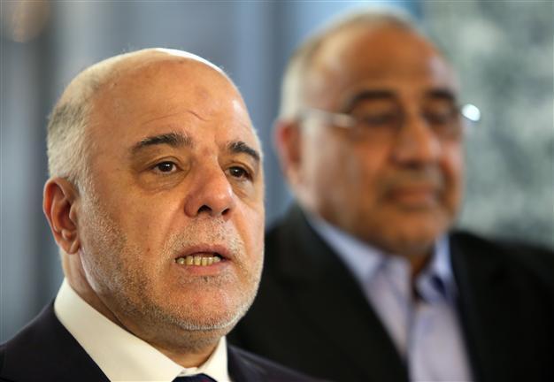 Iraq PM scraps third of cabinet posts in reform drive
