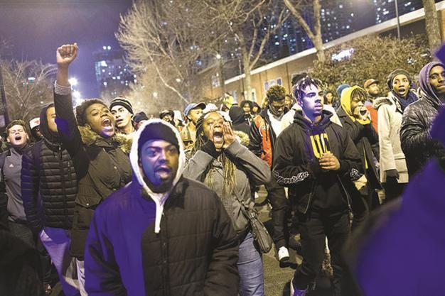 Chicago charges officer in black teen’s death, releases video of shooting