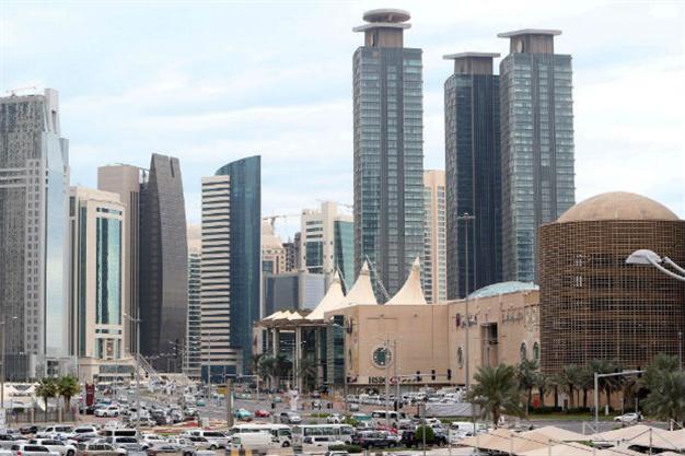 Qatar launches probe after rains exposed poor construction, bans workers from leaving country
