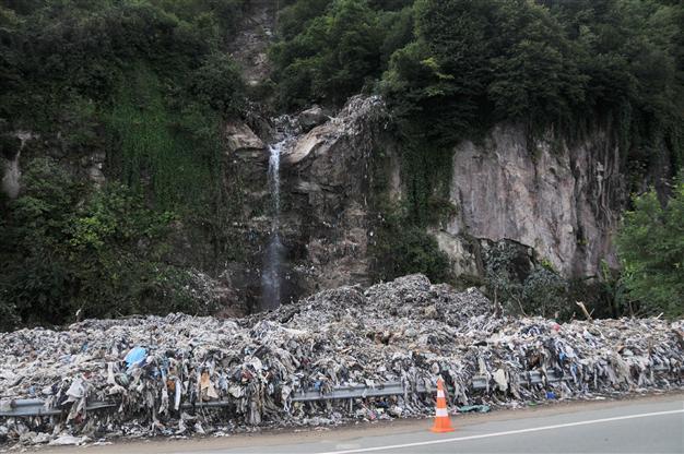 Floodwater reveals illegal dumping site in Black Sea town