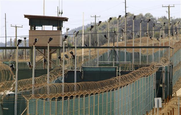 Obama signs bill making Guantanamo prison closure tougher