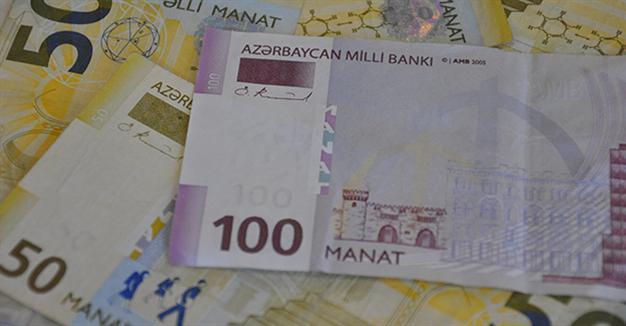 Azerbaijan devalues currency by almost 50 percent