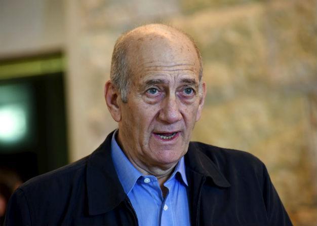 Former Israeli PM Olmerts jail term cut, cleared of main charge
