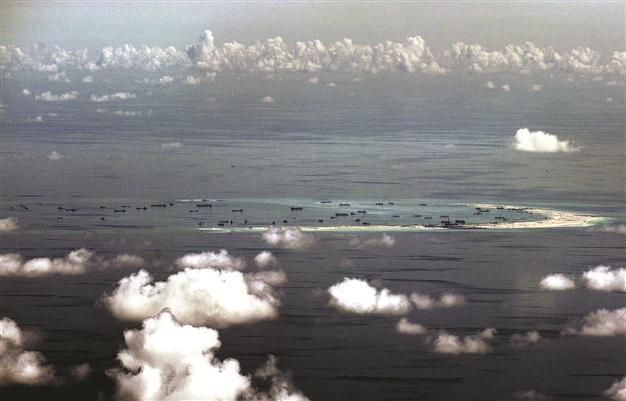 China naval chief warns US of conflict risk in South China Sea