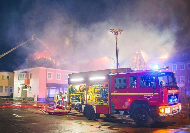 German officials horrified by anti-migrant mobs in eastern state