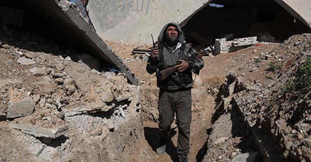 Rebels launch attacks in western Syria, heavy government air raids: monitor