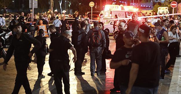 Israel suspends permits after deadly attack