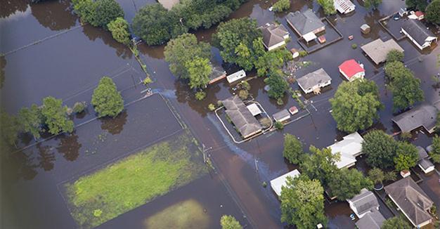 13 killed in Louisiana floods, California fires menace 82,000 people