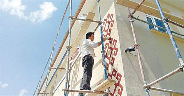 Principal paints school during summer break in central Turkey