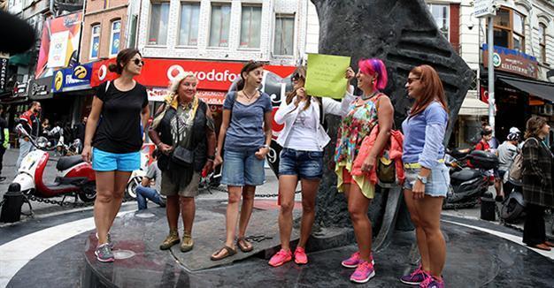 Turks protest assault of woman who wore shorts