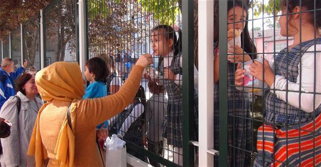 Parents feed children through fences in northwest Turkey school amid state of emergency