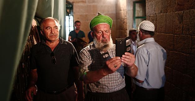 Turks cross to Greek Cyprus for Eid prayers at historic mosque