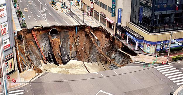 Giant sinkhole swallows Japan city street