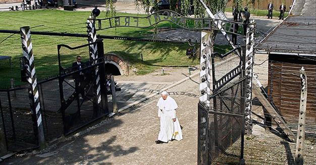 Pope Francis walks alone through horrors of Auschwitz