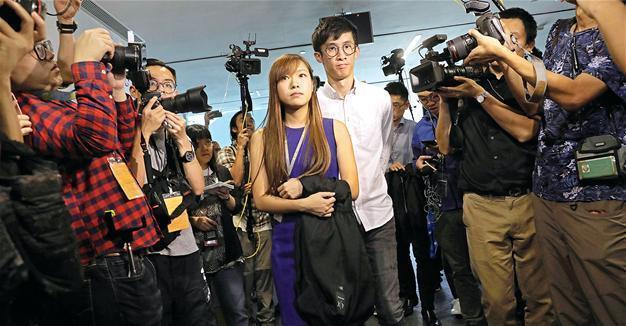 Hong Kong backs China bid to bar rebel lawmakers
