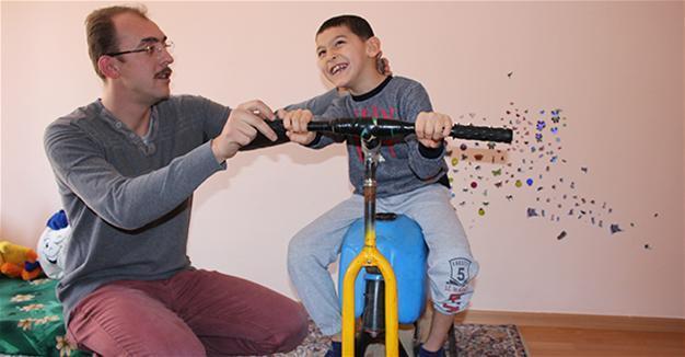 Struggling father builds wooden physiotherapy tool for son in central Turkey