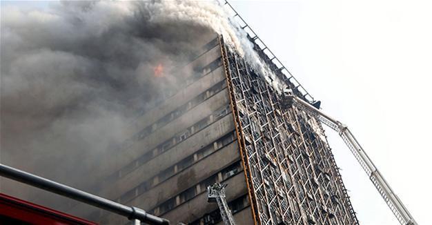 Many Iran firefighters feared trapped in building collapse