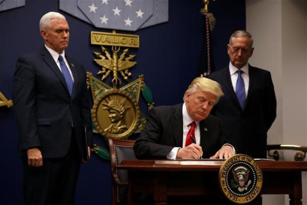 Trump bars door to refugees, visitors from seven nations