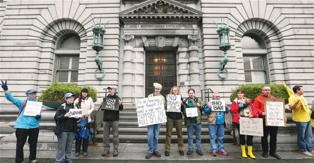Appeals court presses Trump administration on travel ban