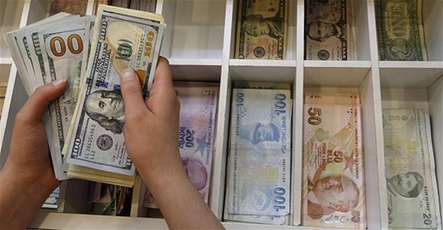 Turkish central bank signals more tightening possible, lira weakens