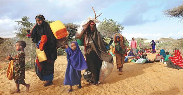 Cloaked in rags and dust, Somalis flee looming famine
