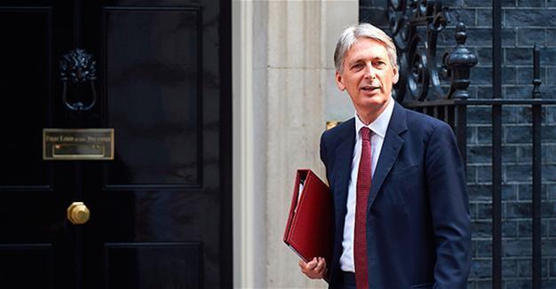 UK’s finance minister says challenge to avoid ‘cliff-edge’ Brexit