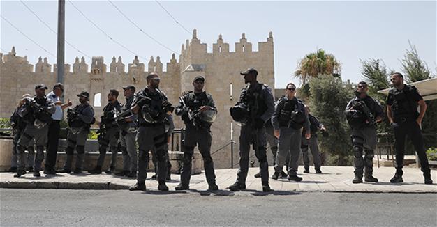 Two Israeli policemen shot dead near Jerusalem holy site, gunmen killed