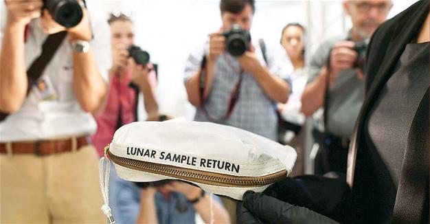 Neil Armstrong’s moon bag sells for $1.8 million at auction