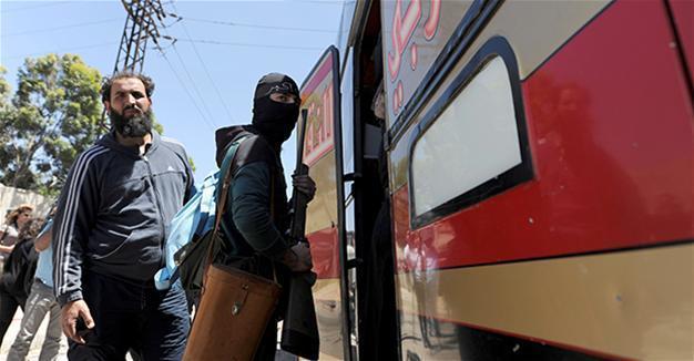 Rebels leave last opposition district in Syria’s Homs