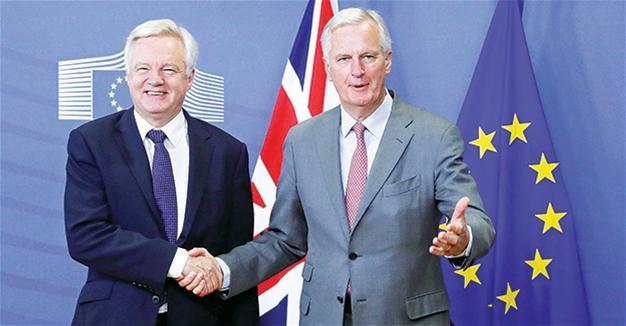 As London squabbles, full Brexit talks start in Brussels