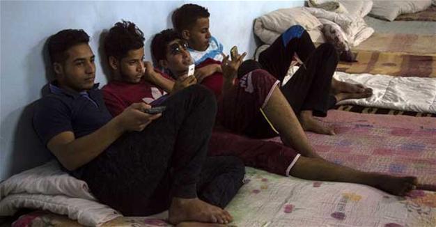 Separated by war, Iraqi children wait for parents