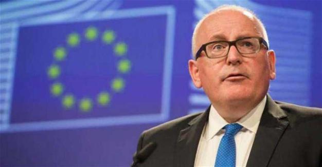 EU warns Poland to suspend court reforms or risk sanctions