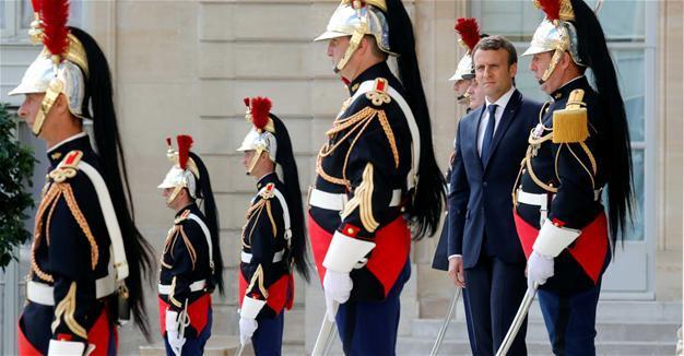 Macron headed for huge majority, but low turnout a concern