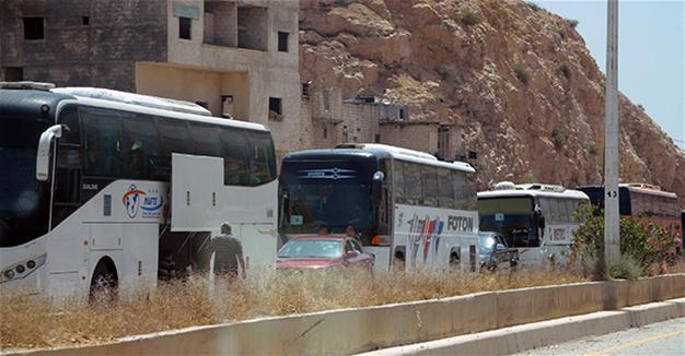 Syrian rebels start leaving Damascus district under evacuation deal