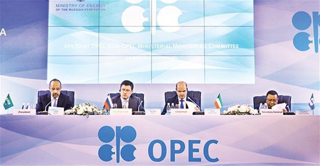 Saudi calls OPEC members to stick to limits, sees oil demand up