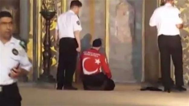 Two men perform prayers inside Istanbul’s Hagia Sophia to protest its closure to Muslim worship
