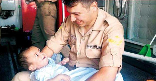 Heartwarming story behind photo of Syrian migrant baby rescued by Turkish coast guards