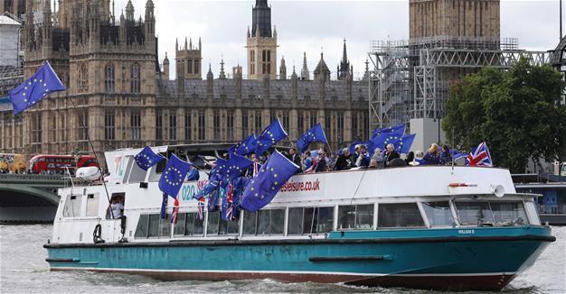 Britain calls on EU to move Brexit talks forward