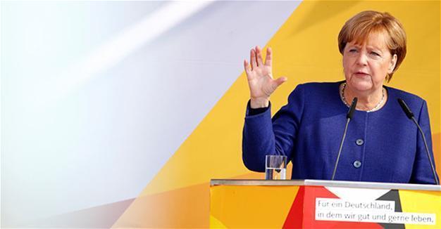 Merkel vows to restrict trade with Turkey over arrests