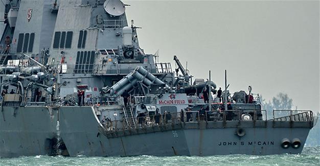 10 sailors missing in collision between US warship, tanker