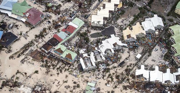Irma kills at least 9, 2 storms upgraded to hurricane status