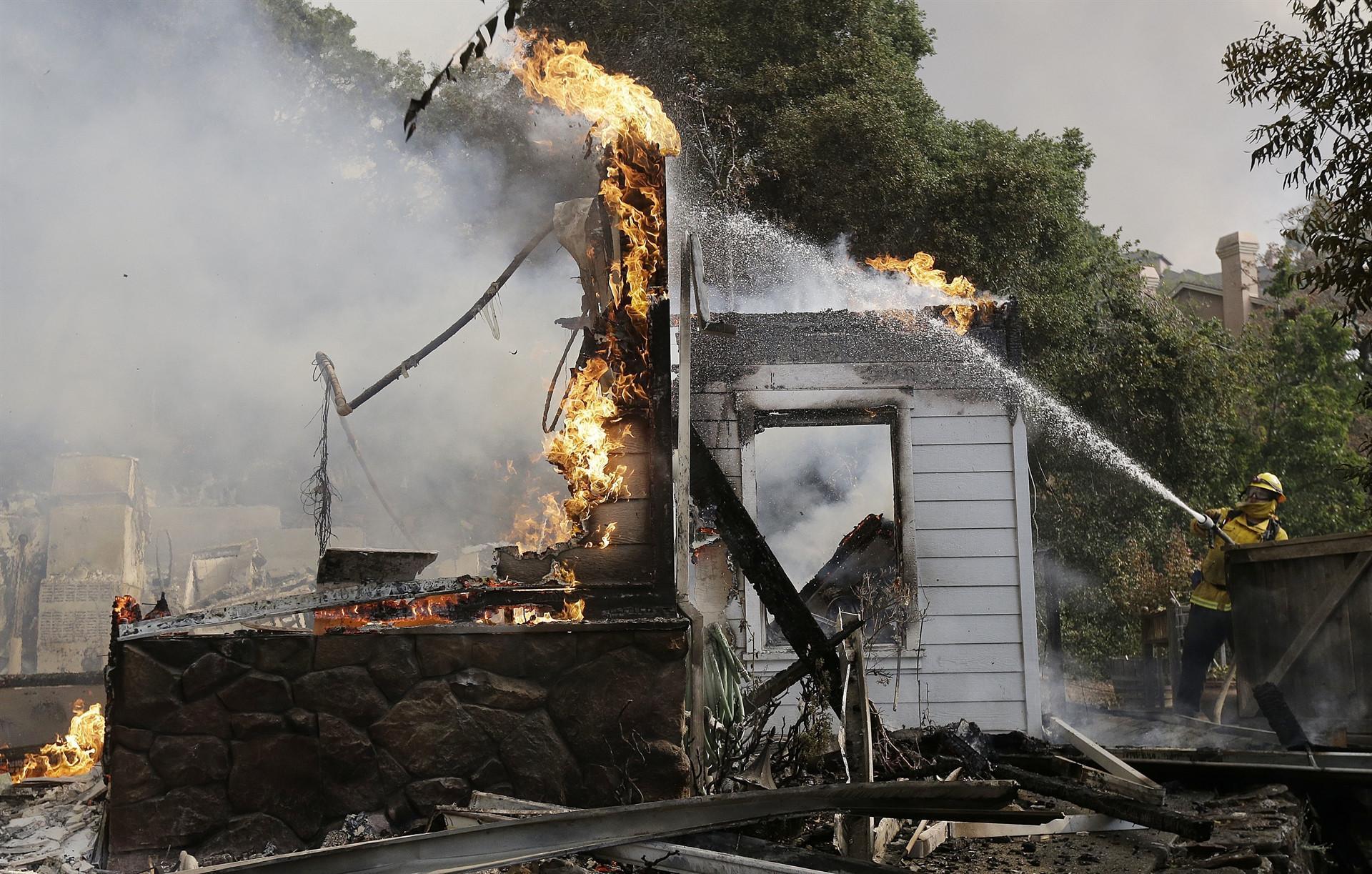Seventh person dies as northern California wildfires spread