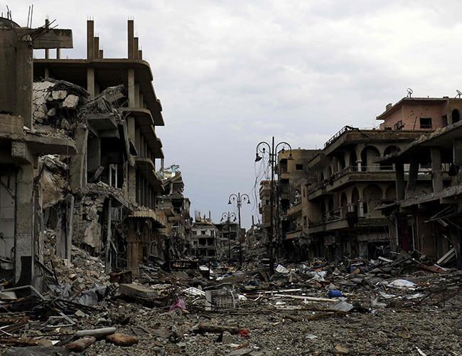 Their ‘caliphate’ in ruins, ISIL militants melt into the desert