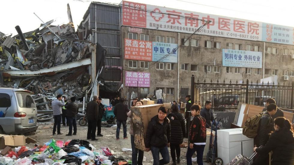 Chinas capital takes on illegal factory, warehouse flats