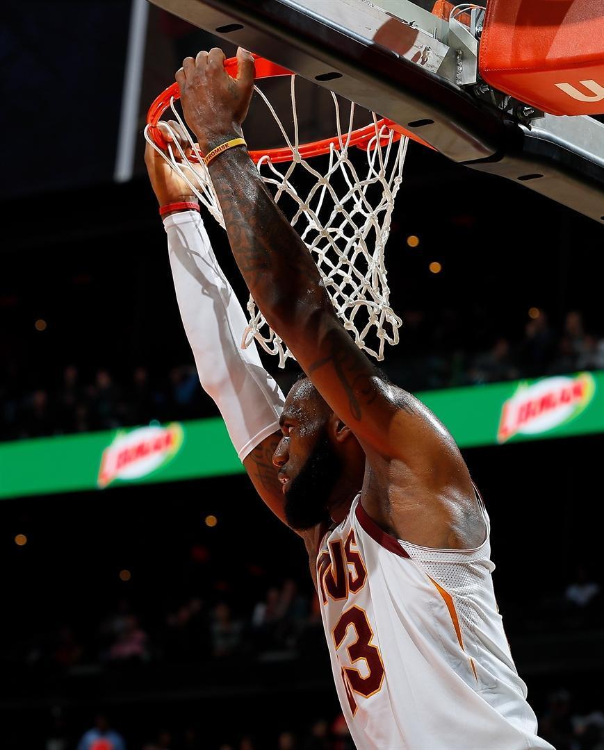 James leads Cavs to No.10, Irving sparks Celtics