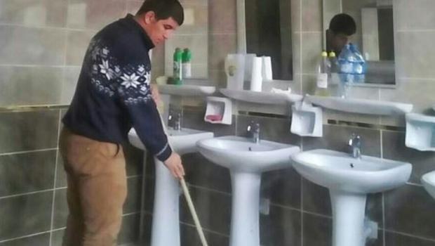 Investigation launched over photo showing Turkish national wrestler mopping floors