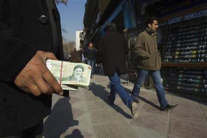Iran raises rates, closes accounts to shore up rial