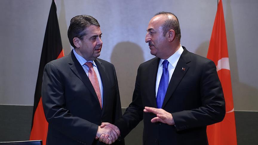 Turkish and German foreign ministers meet in Munich, pledge closer dialogue
