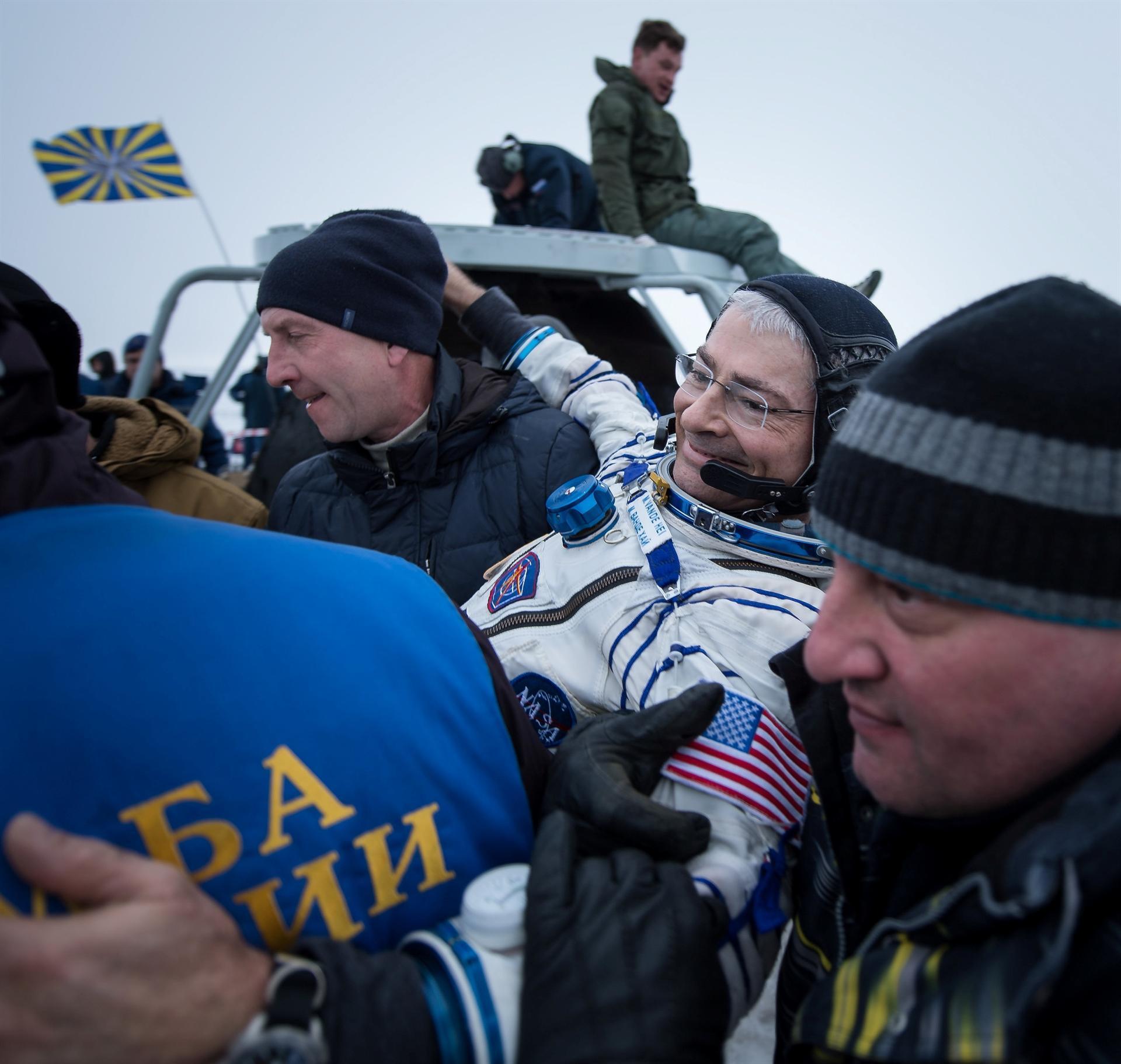 Three space station astronauts return to Earth