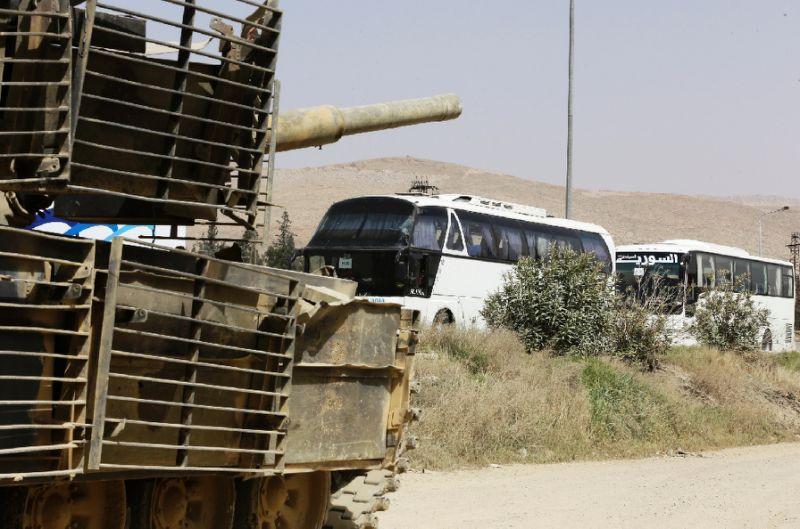 First rebels quit Syria enclave under Russia-brokered deal